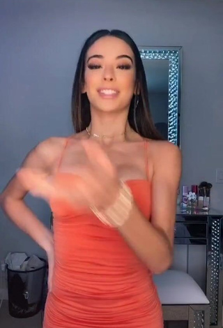 1. Desirable Lauren Kettering Shows Cleavage in Orange Dress