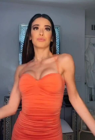 Sexy Lauren Kettering Shows Cleavage in Orange Dress