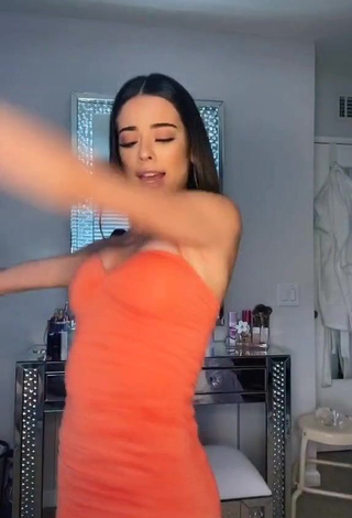 3. Sexy Lauren Kettering Shows Cleavage in Orange Dress