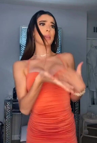 4. Sexy Lauren Kettering Shows Cleavage in Orange Dress