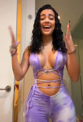 Desirable Malu Trevejo Shows Cleavage in Purple Overall