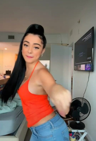 Beautiful Malu Trevejo Shows Cleavage in Sexy Orange Top