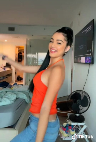 4. Beautiful Malu Trevejo Shows Cleavage in Sexy Orange Top