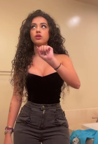 Cute Malu Trevejo Shows Cleavage in Black Top