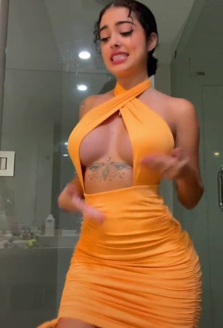 Hot Malu Trevejo Shows Cleavage in Orange Dress