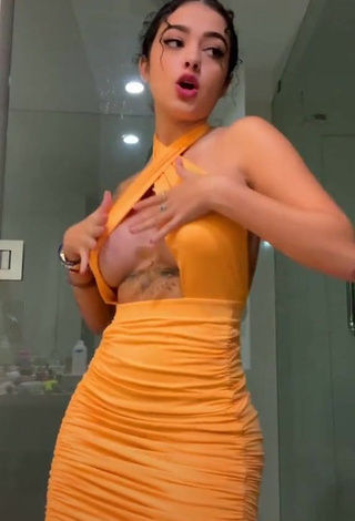 3. Hot Malu Trevejo Shows Cleavage in Orange Dress