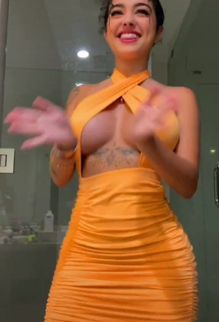 4. Hot Malu Trevejo Shows Cleavage in Orange Dress