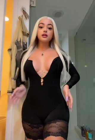 1. Desirable Malu Trevejo Shows Cleavage in Black Dress