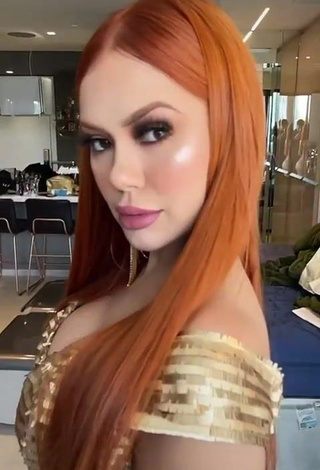 3. Hot Mirela Janis Shows Cleavage in Golden Dress