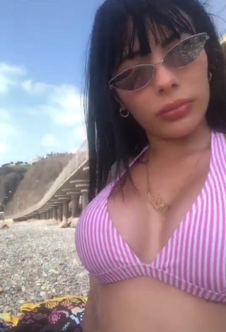 1. Cute Natalia Shows Cleavage in Striped Bikini Top