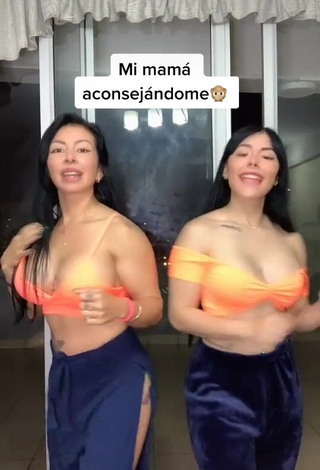 4. Beautiful Natalia Shows Cleavage in Sexy Orange Crop Top