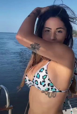 4. Elegant Nathalia Valente in Leopard Bikini on a Boat