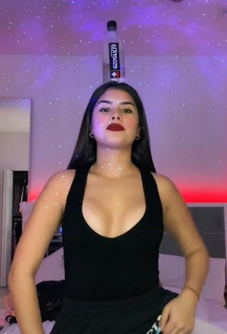 Desirable Nicole García Shows Cleavage in Black Top