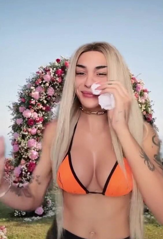 3. Hot Pabllo Vittar Shows Cleavage in Orange Bikini Top