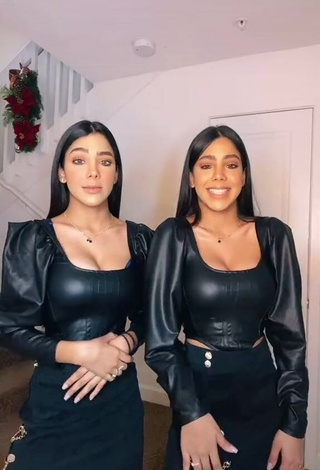 1. Hot Melanie & Meila Shows Cleavage in Black Bodysuit