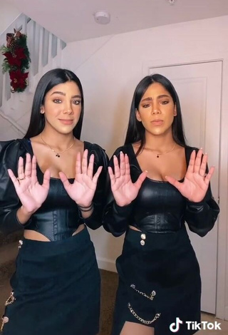 Hot Melanie & Meila Shows Cleavage in Black Bodysuit