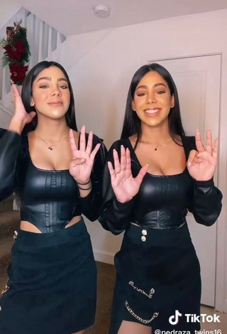 3. Hot Melanie & Meila Shows Cleavage in Black Bodysuit