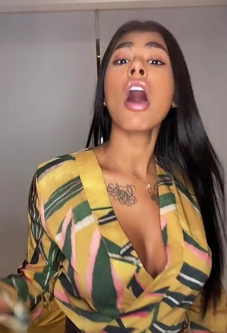 1. Hot Jully Oliveira Shows Cleavage in Floral Overall