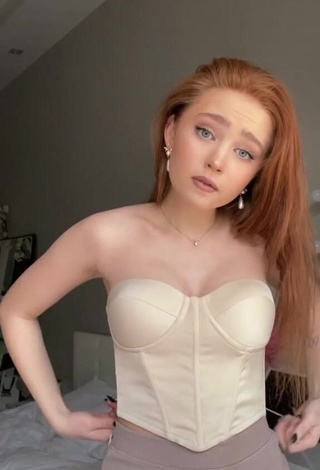 Cute riwww Shows Cleavage in Beige Corset