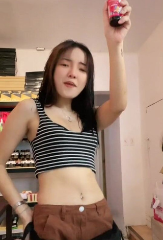 3. Hot Rosemarie Tan in Striped Crop Top