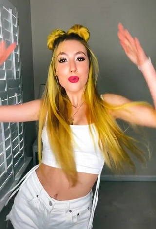 Hot Kings Shows Cleavage in White Crop Top