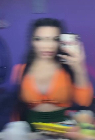 1. Desirable Vai Monroe Shows Cleavage in Orange Crop Top