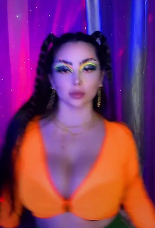 Beautiful Vai Monroe Shows Cleavage in Sexy Orange Crop Top