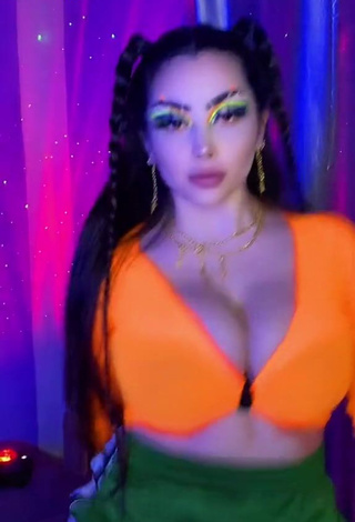 3. Beautiful Vai Monroe Shows Cleavage in Sexy Orange Crop Top