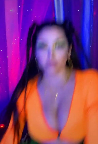 4. Beautiful Vai Monroe Shows Cleavage in Sexy Orange Crop Top