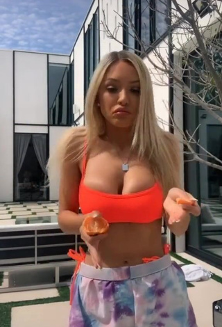 4. Sexy Abby Rao Shows Cleavage in Orange Bikini Top