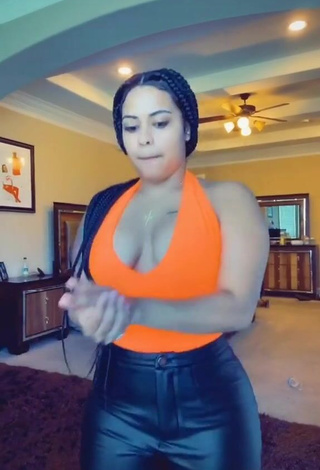 4. Sexy Carmen Pritchett Shows Cleavage in Electric Orange Top