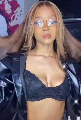 Sexy Caeli Shows Cleavage in Black Bra